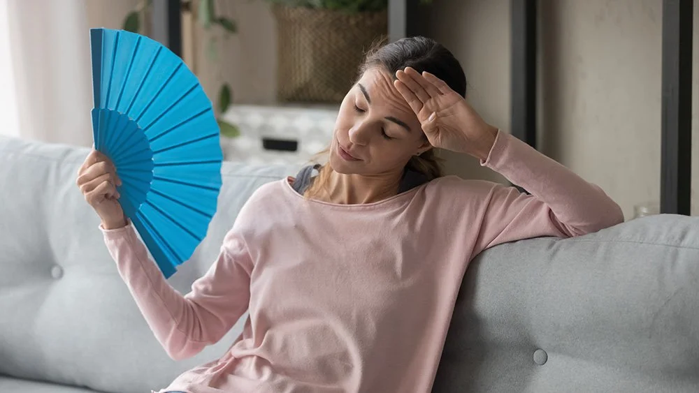 Girl feeling uncomfortable without air conditioning  - heat pump troubleshooting