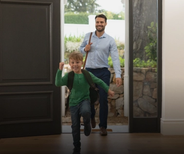 A father and a son entering their home