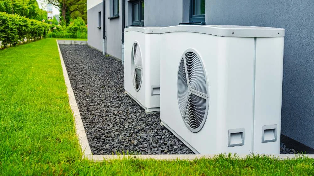 two heat pump outdoor units in summer