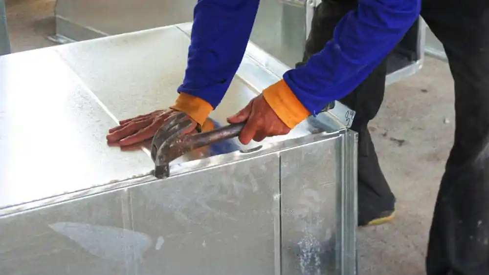 An expert fixing AC vent.