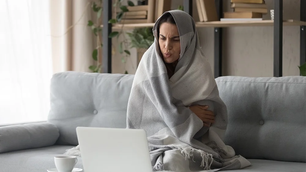 Girl shivering when heat pump isn't working
