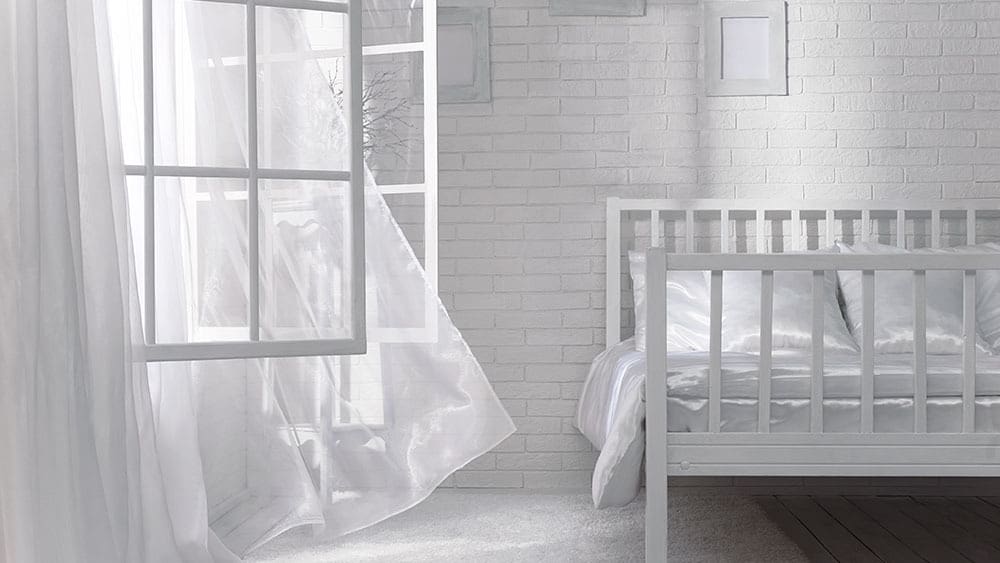 A room with an opened window.