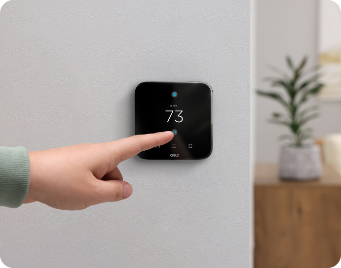 A person adjusting temperature on breez edge