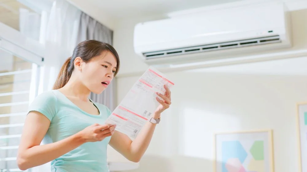 woman shocked because of high electric bills