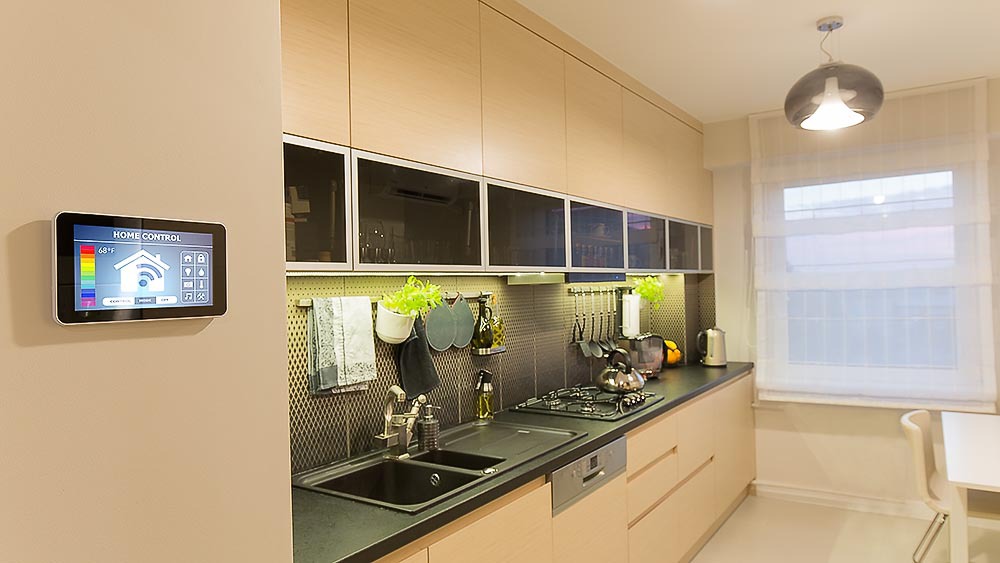 Smart thermostat placed in the kitchen