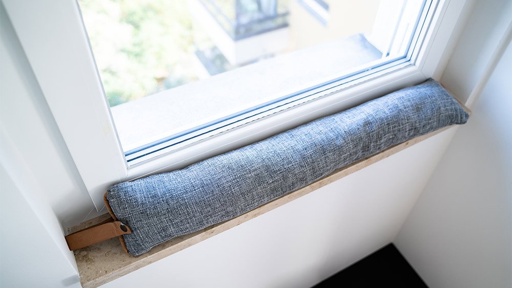 draft excluder under window blocking cold