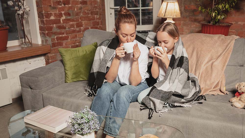 Girls enjoying hot chocolate in chilly weather