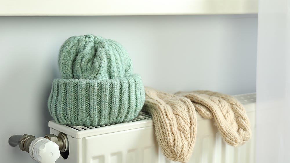 Drying hats and mittens on a radiator to combat dry winter air