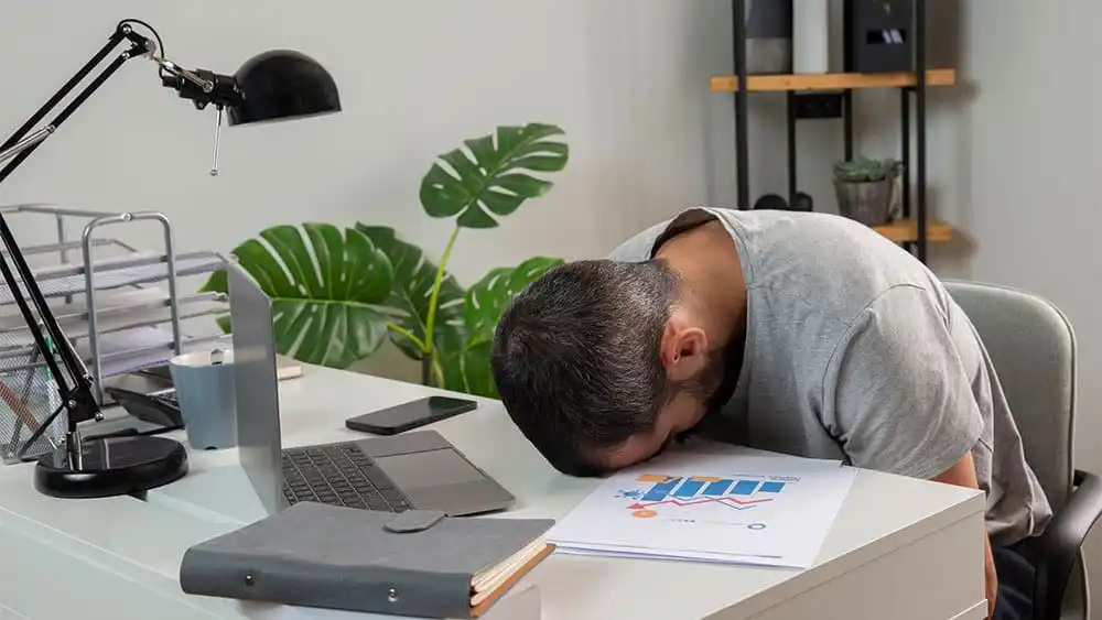 Man tired after working from home.