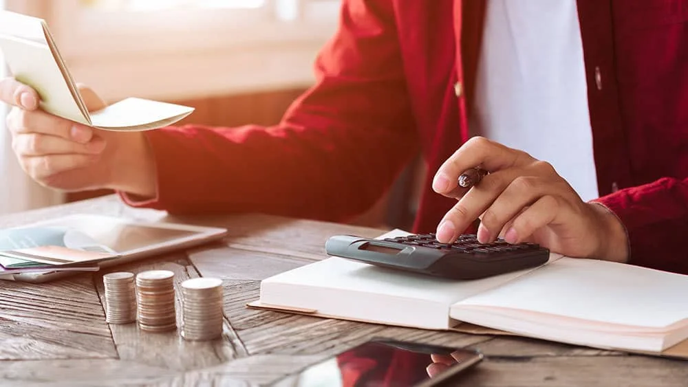 man calculating HVAC costs