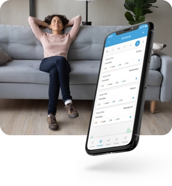 Woman relaxing as cielo smart thermostat is maintaining ideal room temperature.