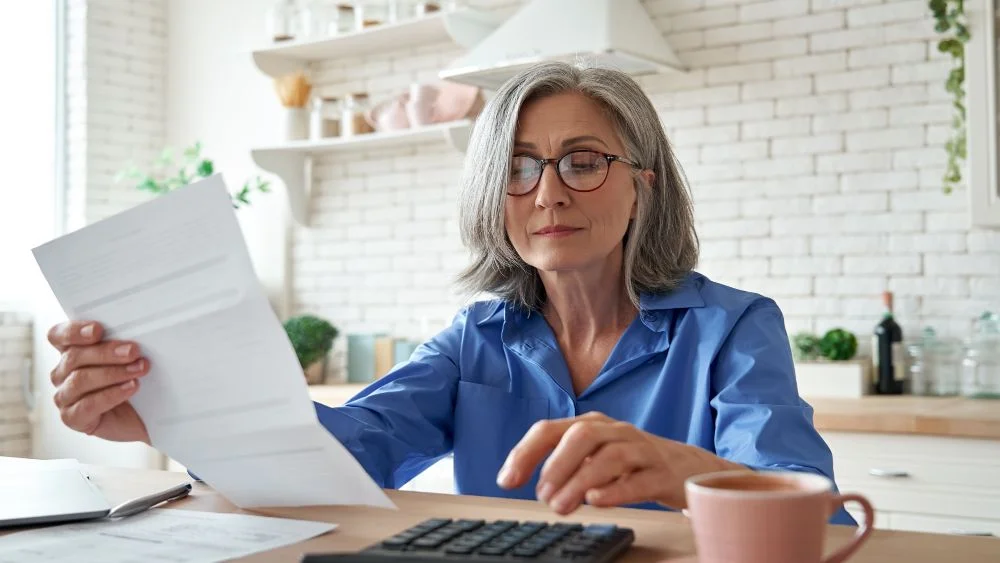 woman calculating energy bills