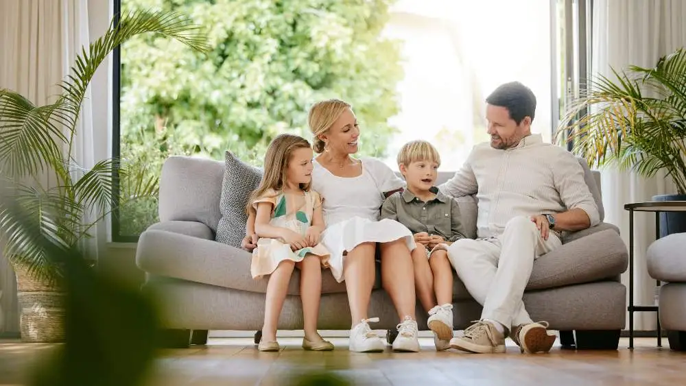 family sitting on a sofa