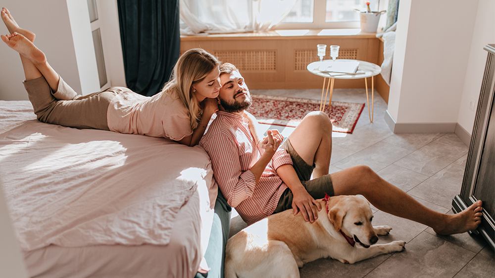Family relaxing with their dog