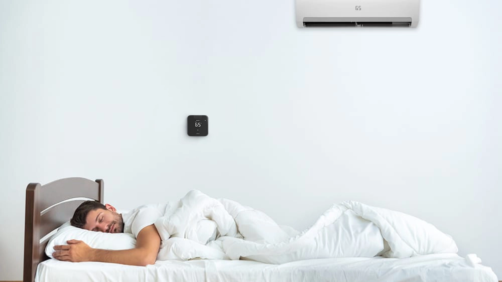 A person sleeping while Breez Max, a smart AC controller maintains ideal sleeping temperature