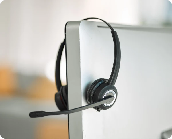 A headphone hanging on a computer