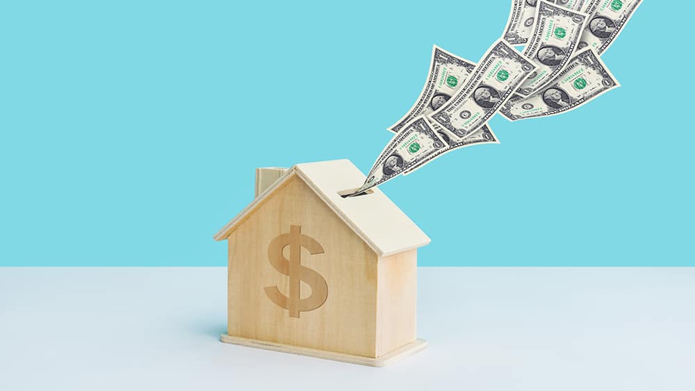 Radiant floor heating cost. house with dollars