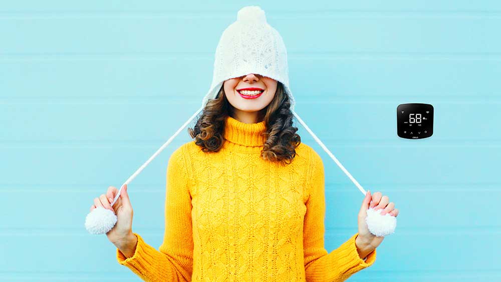 Girl wearing warm clothes to stay warm in winter with Cielo Breez device.