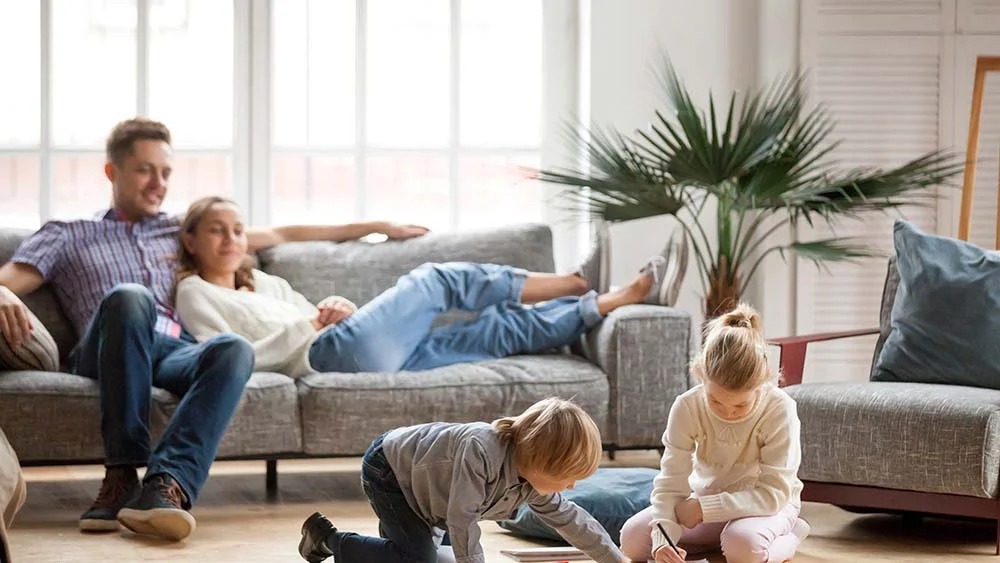 family relaxing in living room