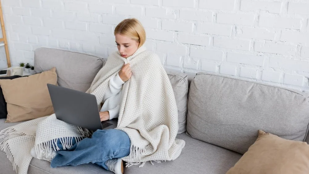 woman feeling cold in her home